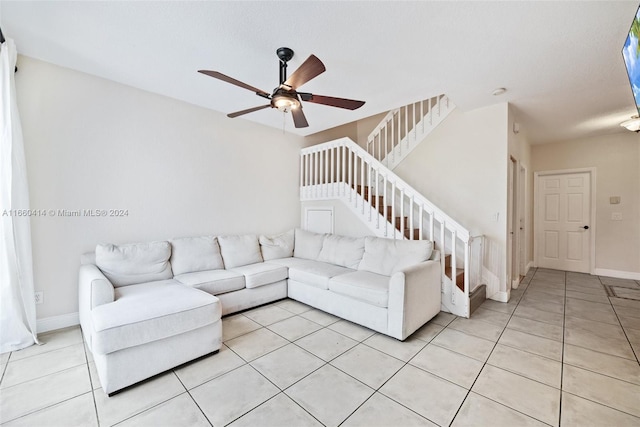 living room featuring ceiling fan and light tile patterned floors