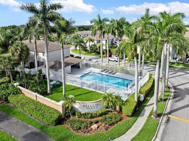 view of swimming pool featuring a lawn