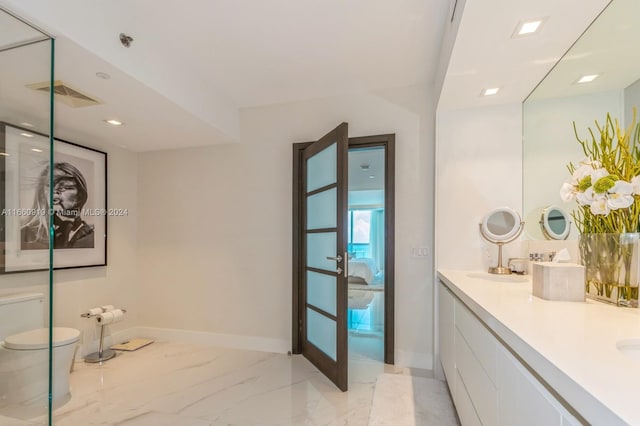 bathroom with vanity and toilet