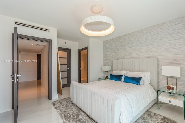 bedroom featuring tile walls and light tile patterned floors