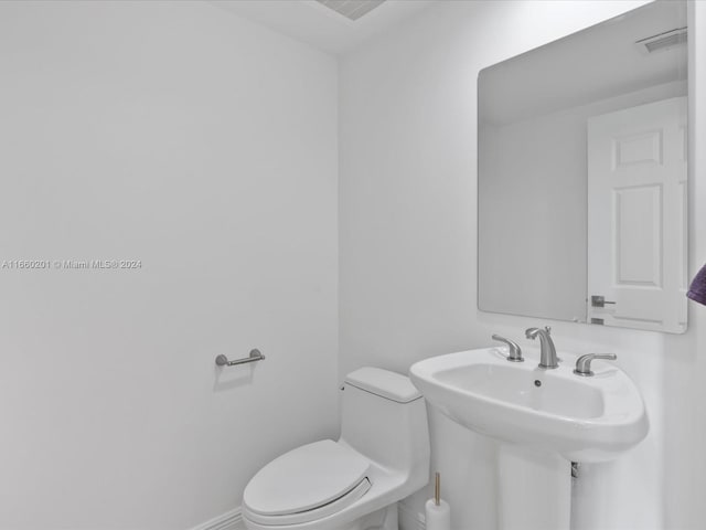 bathroom featuring toilet