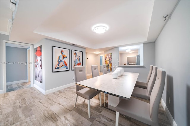 dining room with light hardwood / wood-style flooring