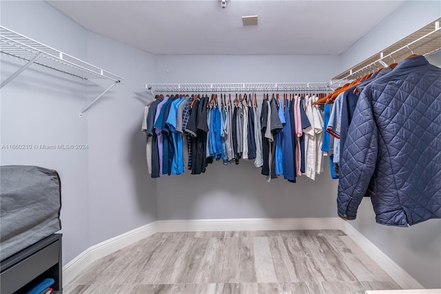 walk in closet featuring hardwood / wood-style floors