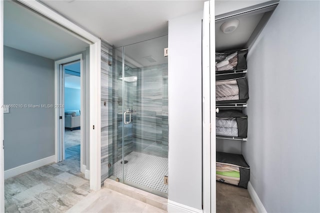 bathroom featuring an enclosed shower