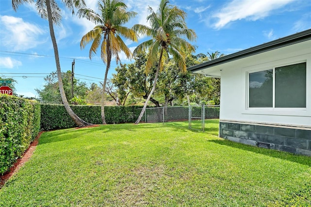 view of yard with a fenced backyard