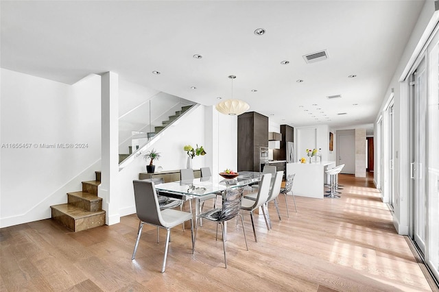 dining area with recessed lighting, stairs, visible vents, and light wood-style flooring