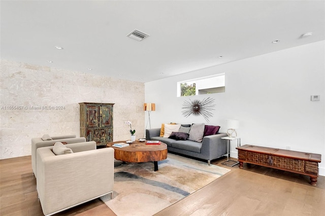 living room featuring recessed lighting, visible vents, and wood finished floors