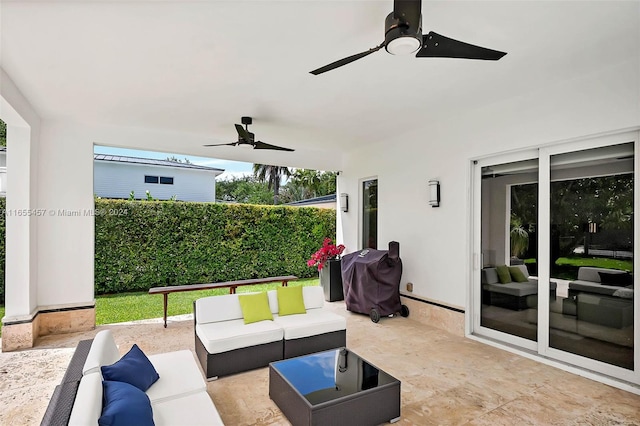 view of patio / terrace featuring an outdoor living space, a ceiling fan, and a grill