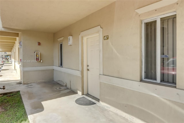 entrance to property featuring a patio area