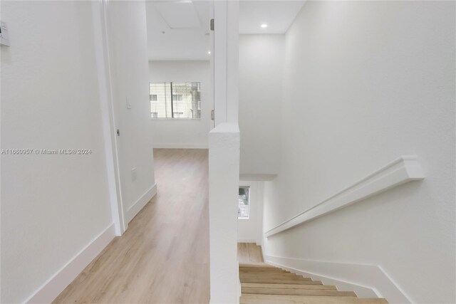 staircase featuring hardwood / wood-style floors