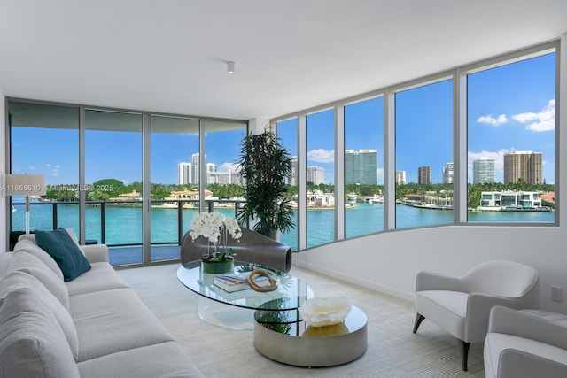 sunroom / solarium with a water view