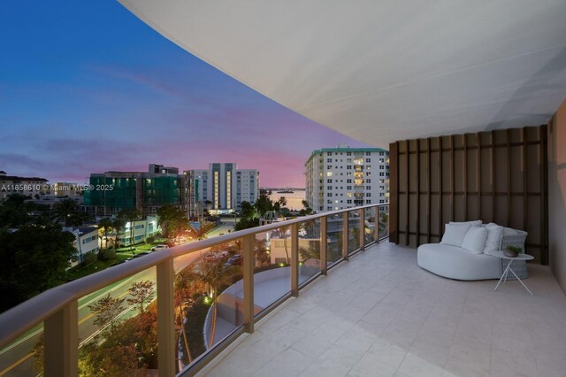 view of balcony at dusk