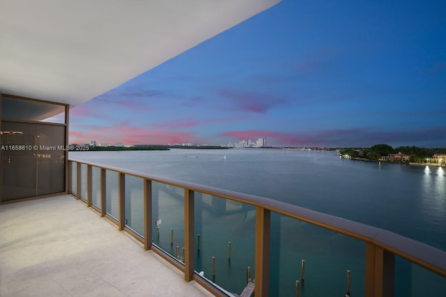 balcony at dusk with a water view