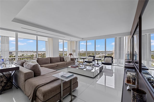 living room with light tile patterned floors and expansive windows