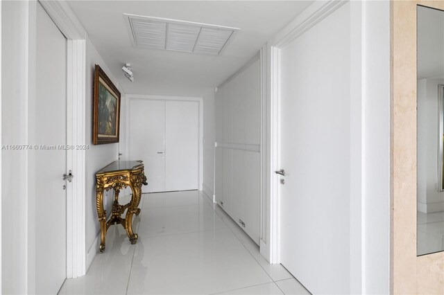 hallway with light tile patterned floors