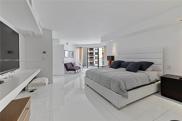 tiled bedroom featuring access to outside