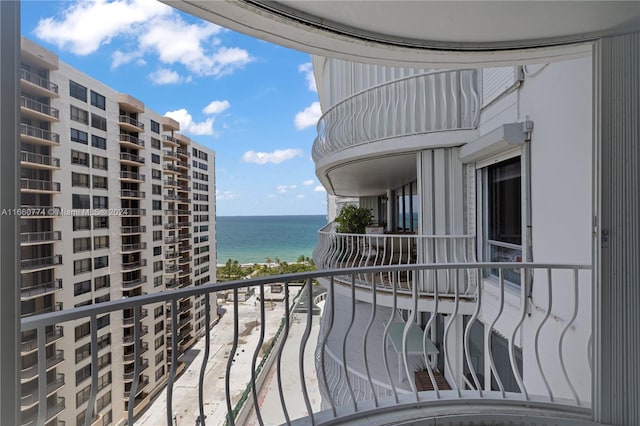 balcony featuring a water view