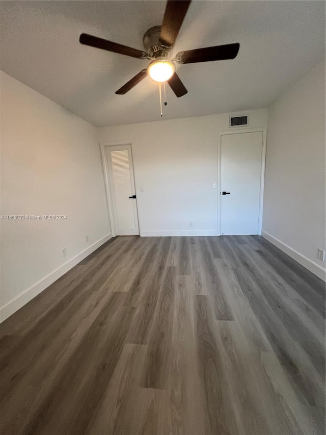 unfurnished bedroom featuring ceiling fan and wood-type flooring