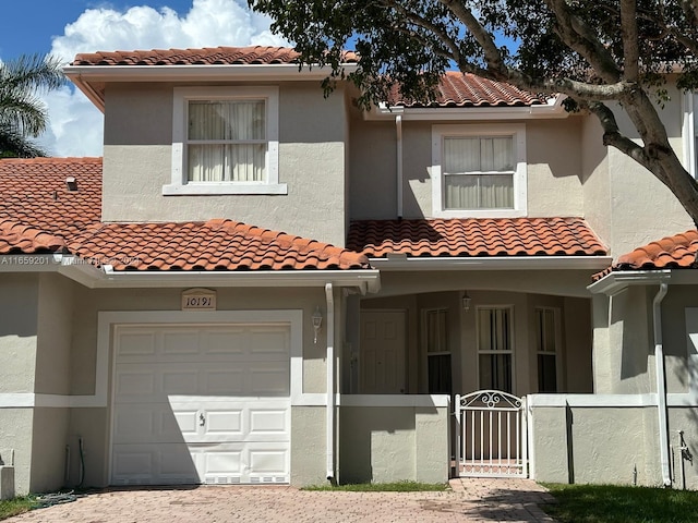 mediterranean / spanish-style house featuring a garage