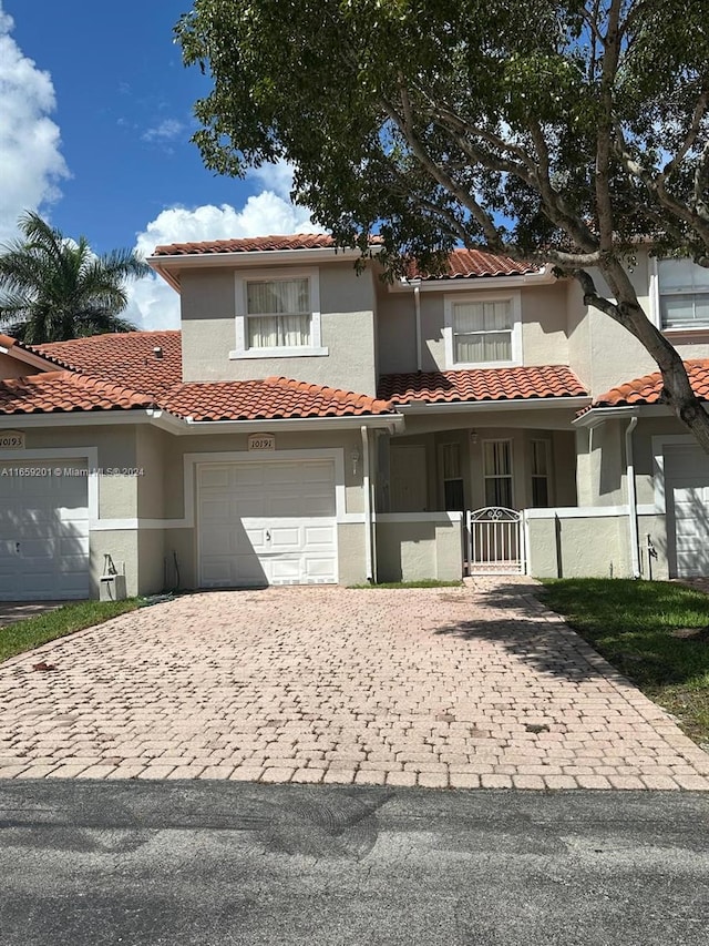 mediterranean / spanish-style house featuring a garage