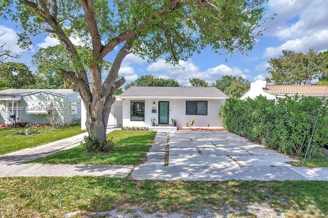 view of front of property with a porch and a garage