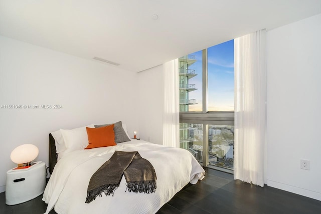 bedroom featuring dark hardwood / wood-style flooring