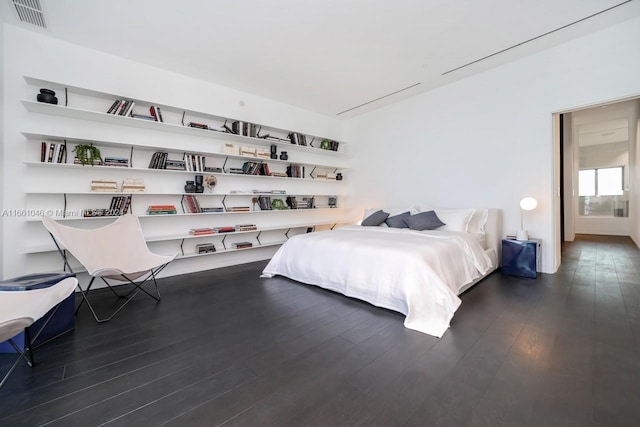 bedroom featuring dark wood-type flooring