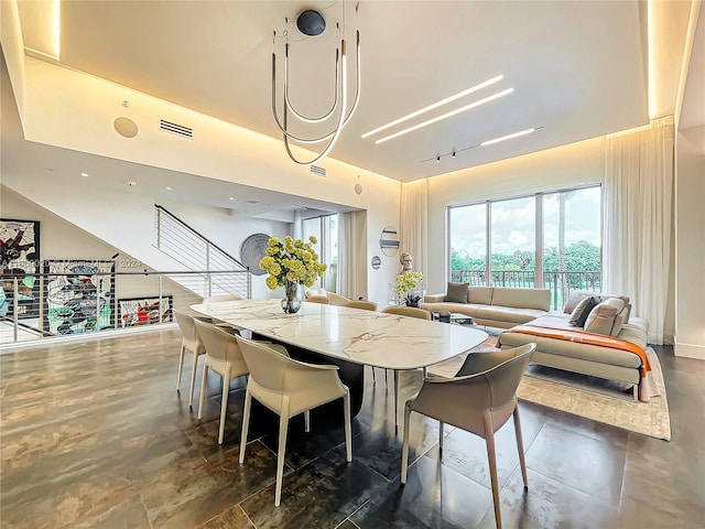 dining room featuring track lighting