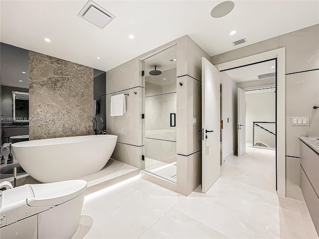 bathroom featuring shower with separate bathtub, vanity, and tile walls