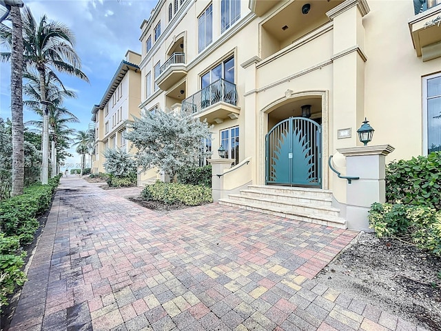 entrance to property with a balcony