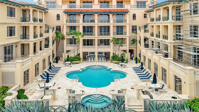 view of swimming pool with a patio