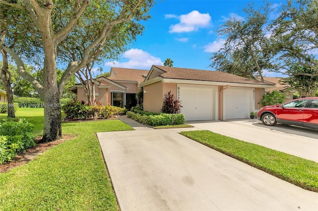 single story home featuring a garage and a front yard