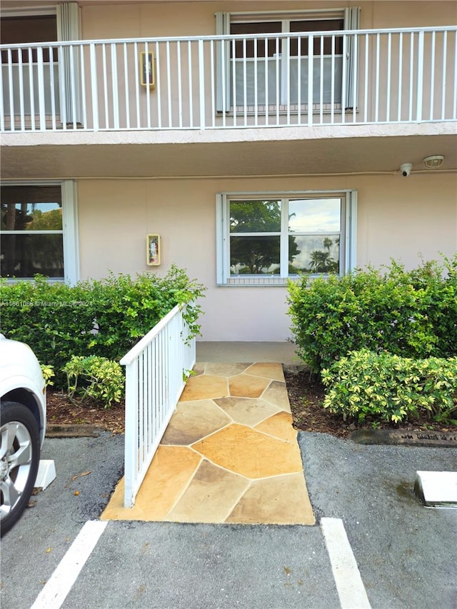 doorway to property featuring a balcony