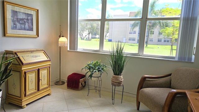 sitting room with light tile patterned floors