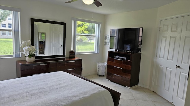 bedroom with light tile patterned floors and ceiling fan