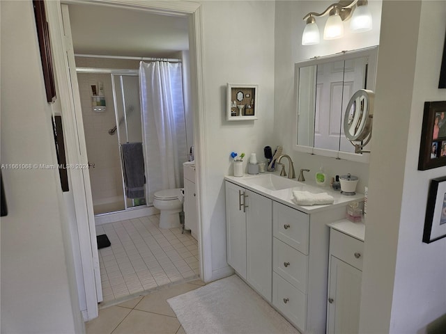 bathroom with tile patterned flooring, vanity, toilet, and a shower with curtain