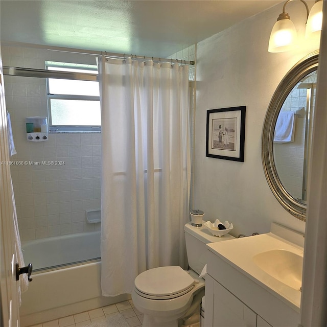 full bathroom featuring vanity, tile patterned flooring, toilet, and shower / bath combo