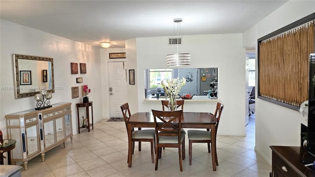 tiled dining room with plenty of natural light