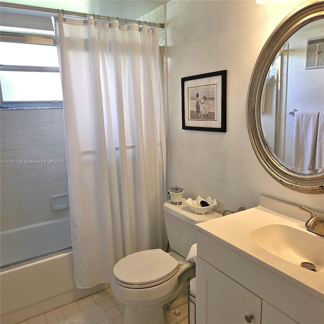 full bathroom with shower / bath combo, tile patterned flooring, vanity, and toilet