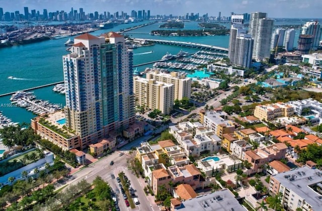 birds eye view of property featuring a water view