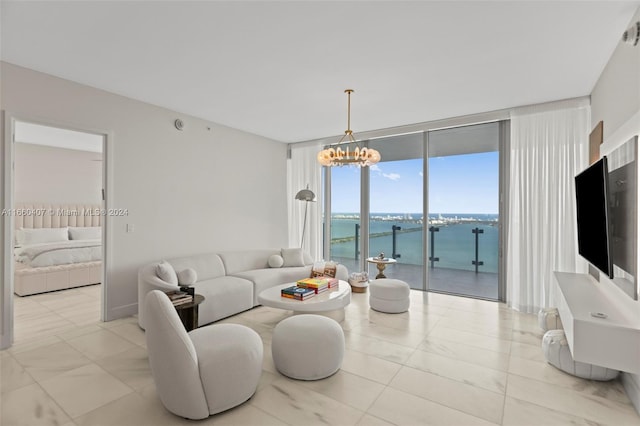 living room featuring a notable chandelier and floor to ceiling windows