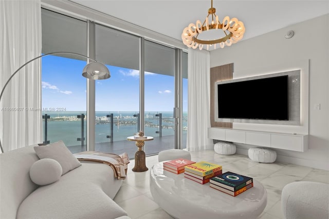 living room with a notable chandelier and tile patterned floors