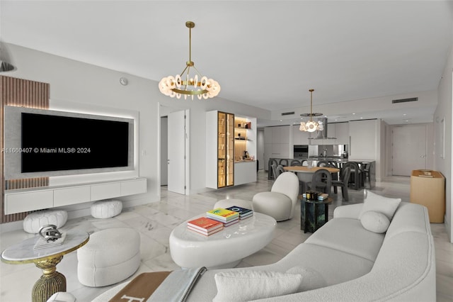 living room featuring an inviting chandelier