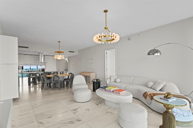 living room featuring a notable chandelier