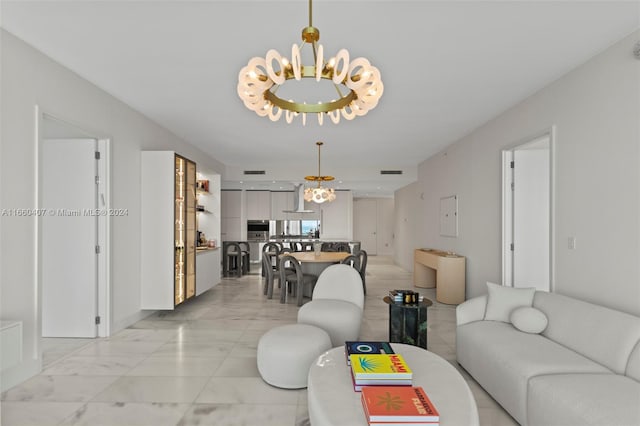 living room featuring a notable chandelier