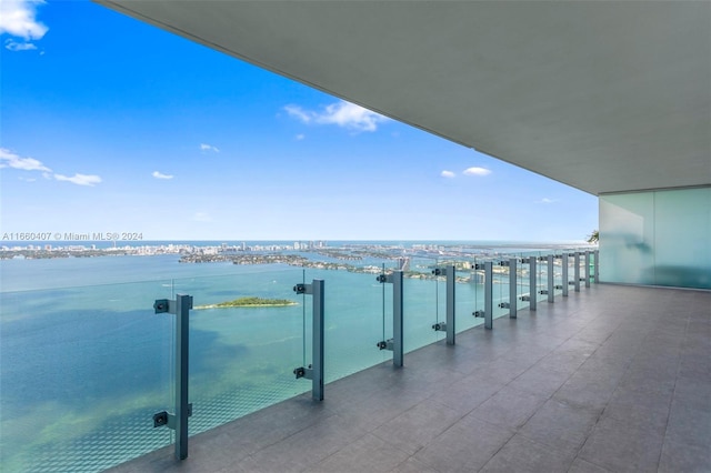 balcony featuring a water view