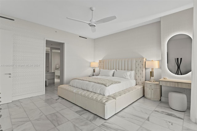 bedroom with ensuite bath and ceiling fan