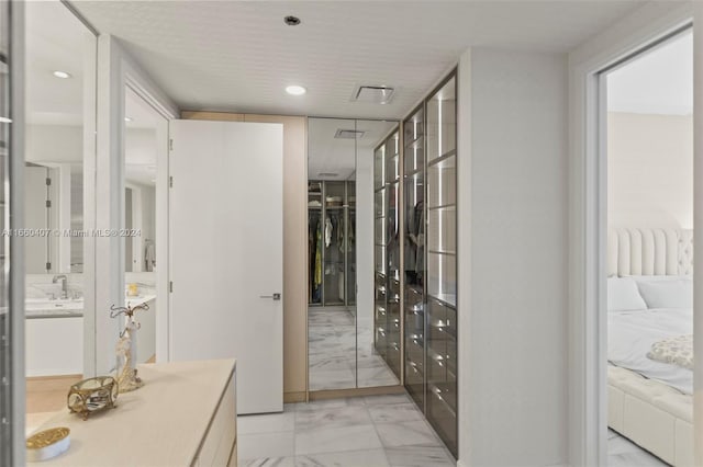 bathroom with a textured ceiling and vanity