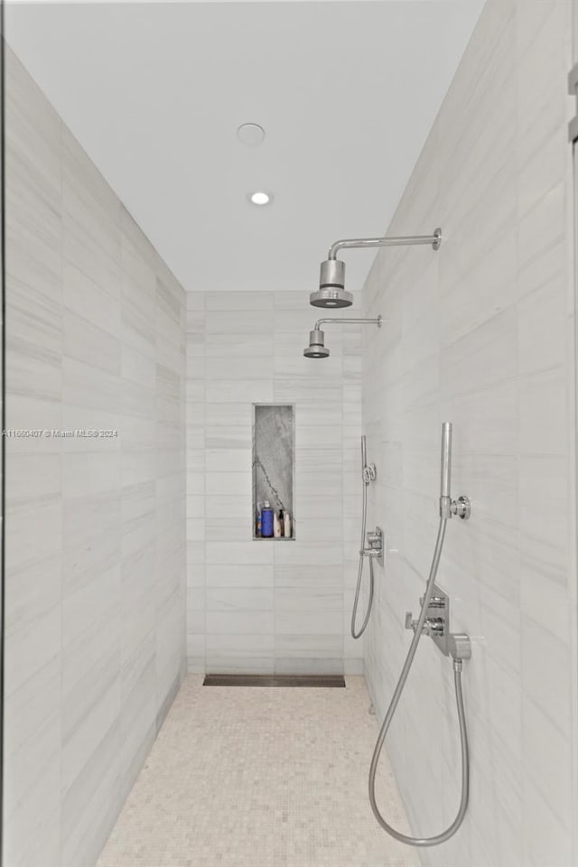 bathroom with a tile shower