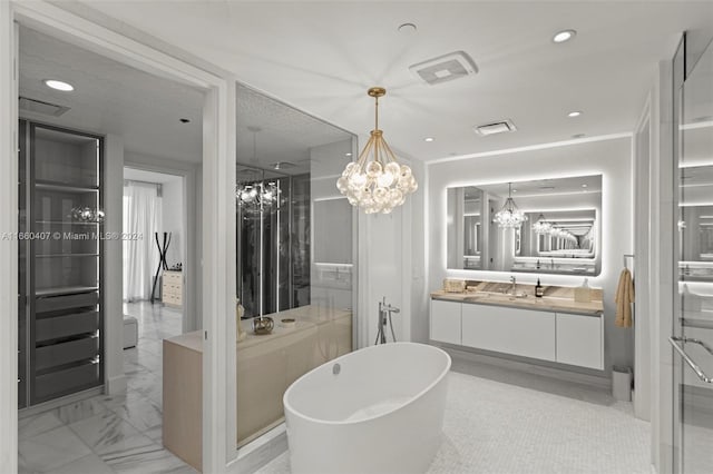 bathroom featuring vanity, a chandelier, and plus walk in shower